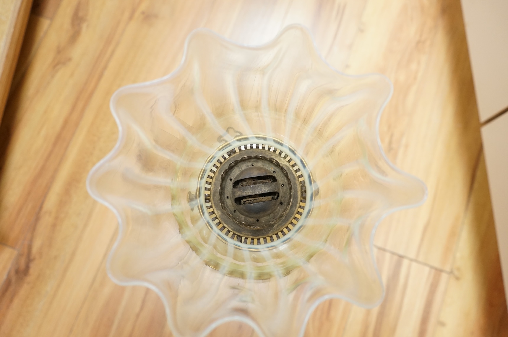 An Edwardian vaseline glass and brass oil lamp and shade, 56cm high